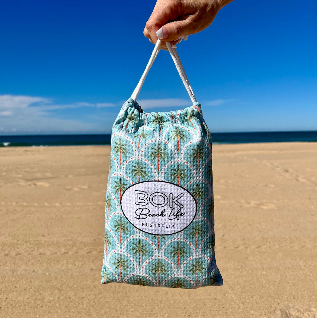 Fabric drawstring bag with palm tree pattern and &