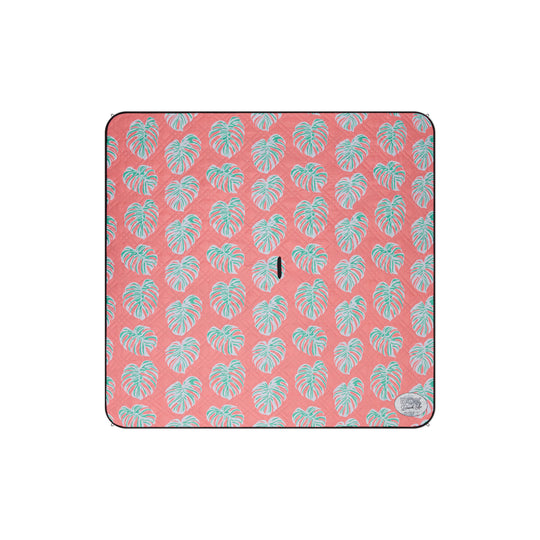 Orange 2m x 2m picnic mat featuring light green monstera leaves